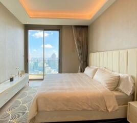 Modern bedroom with large window and city view