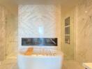 Modern bathroom with standalone bathtub and marble finish