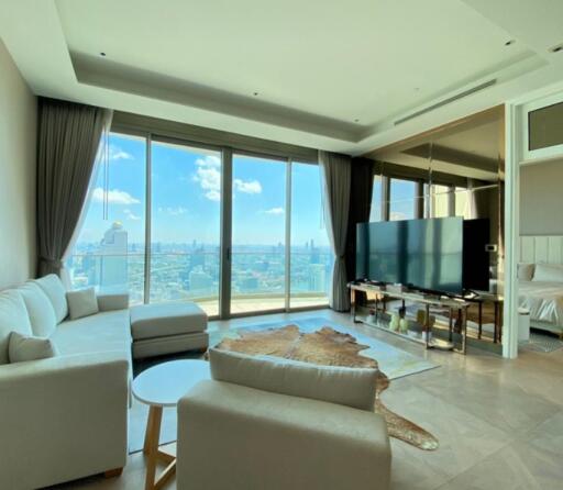 Spacious living room with large windows and a city view