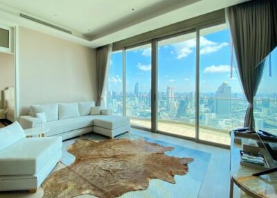 Spacious living room with large windows and city view