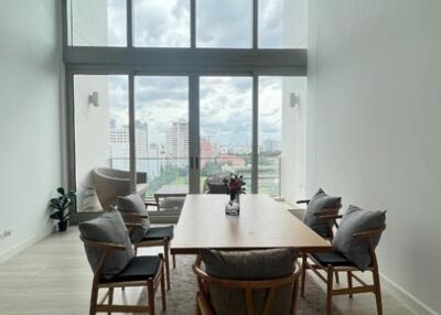 Modern dining room with large windows and city view