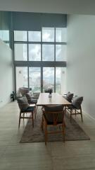 Modern dining room with large windows and city view