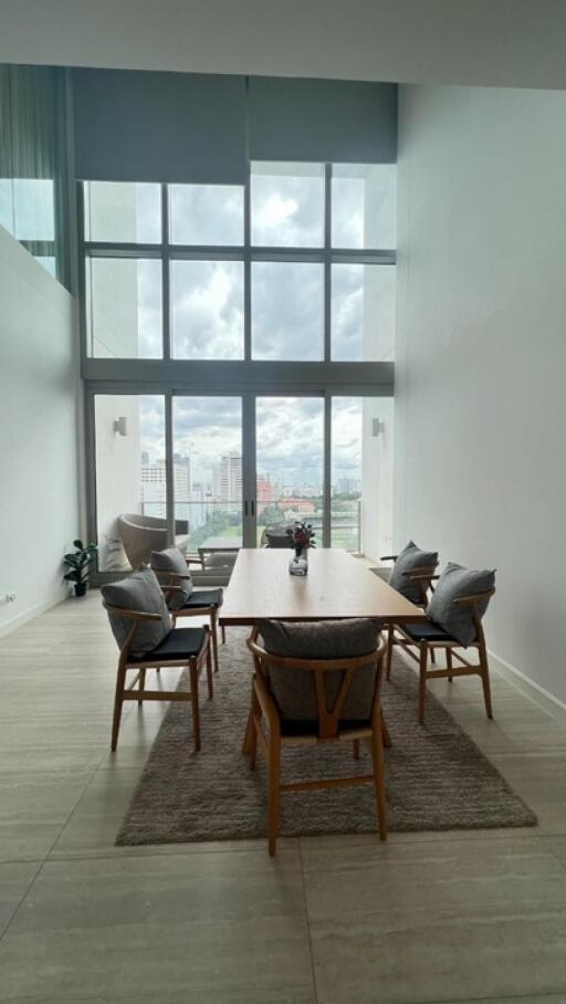 Modern dining room with large windows and city view