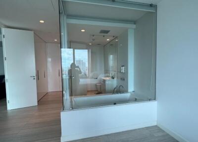 Modern bathroom with a glass-enclosed bathtub