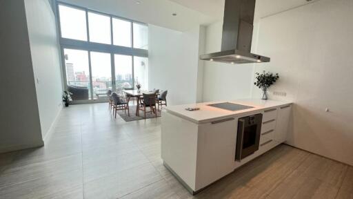 Modern kitchen and dining area with large windows