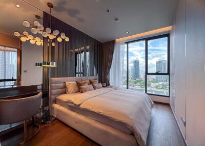 Modern bedroom with large windows and city view