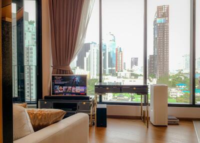 Modern living room with large windows and city view