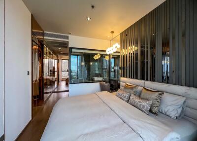 Modern bedroom with large bed and glass wall