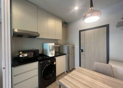 Modern kitchen with appliances and dining table