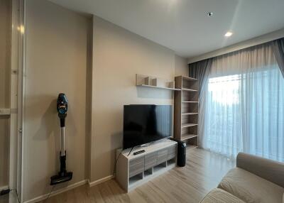 Modern living room with TV and shelving units