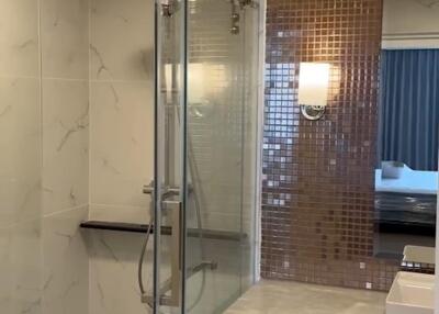 Modern bathroom with glass shower and vanity