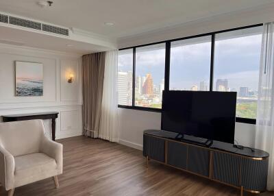 Modern living room with large window and city view