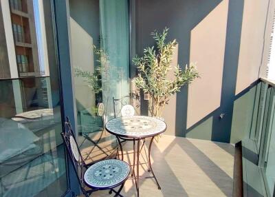 Modern balcony with seating and potted plant