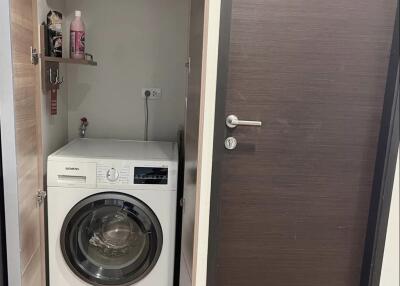 Compact utility area with front-loading washing machine