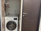 Compact utility area with front-loading washing machine