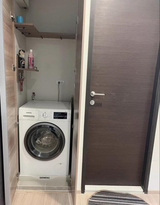 Compact utility area with front-loading washing machine