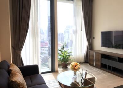 Modern living room with large windows and a city view