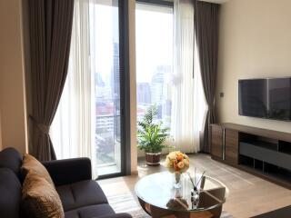 Modern living room with large windows and a city view