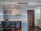 Modern kitchen with built-in appliances and open shelving