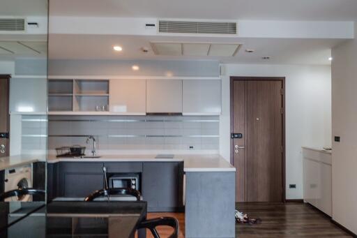 Modern kitchen with built-in appliances and open shelving