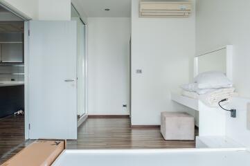 Modern minimalist bedroom with wooden flooring