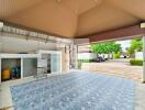 Covered garage with tiled floor and storage area