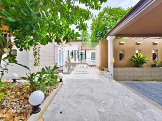 Outdoor area with driveway and greenery