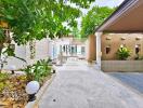 Outdoor area with driveway and greenery