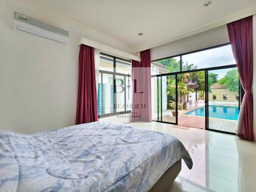 Bedroom with a pool view