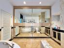 Spacious bathroom with modern amenities and large mirrors