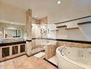 Spacious bathroom with jacuzzi and shower