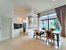 Modern dining area with large windows and pool view