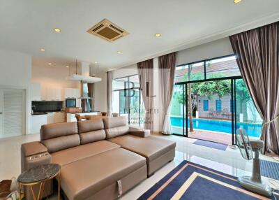 Modern living room overlooking a pool