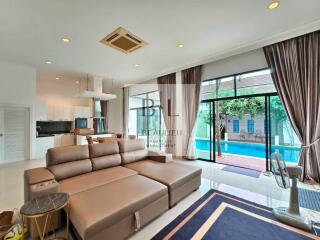 Modern living room overlooking a pool