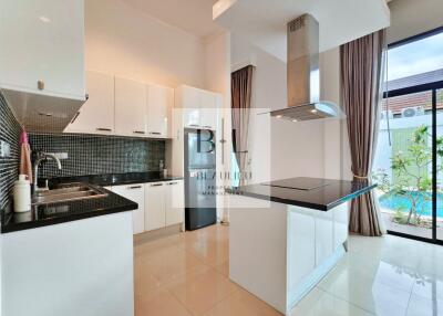 Modern kitchen with white cabinets and island