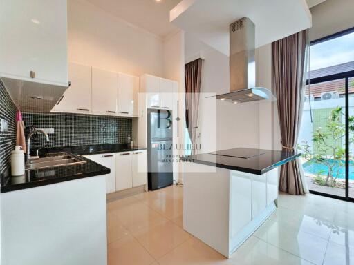 Modern kitchen with white cabinets and island