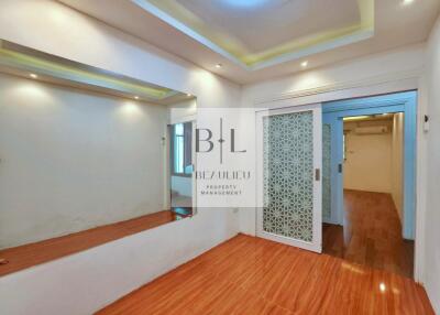 Living room with wood flooring and decorative sliding door