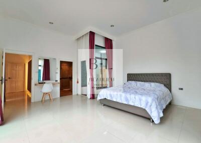 Spacious modern bedroom with en-suite bathroom and study area