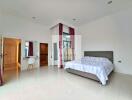 Spacious modern bedroom with en-suite bathroom and study area