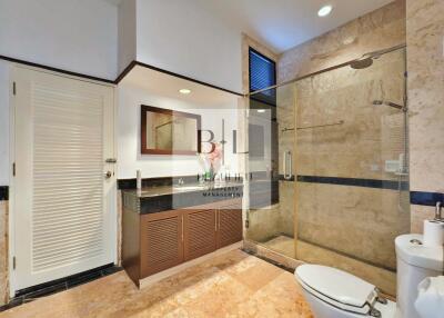 Modern bathroom with glass-enclosed shower