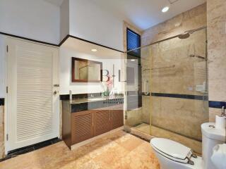 Modern bathroom with glass-enclosed shower