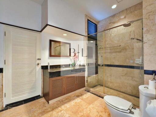 Modern bathroom with glass-enclosed shower