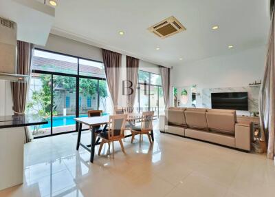 Spacious living room with pool view