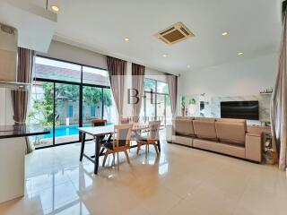 Spacious living room with pool view