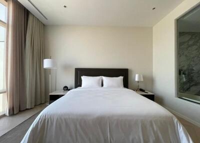 Modern bedroom with double bed and bedside lamps