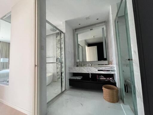 Modern bathroom with glass shower and marble sink