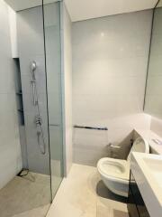 Modern bathroom with walk-in shower and toilet