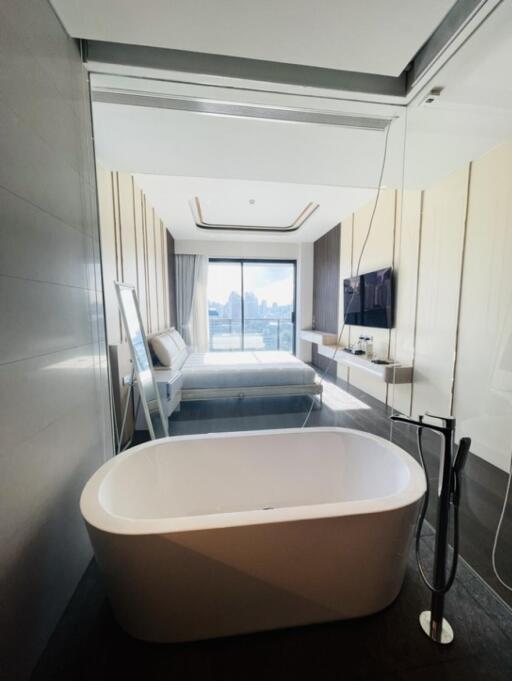 Modern bathroom with freestanding bathtub and glass partition