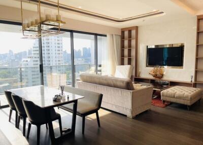 Modern living room with dining area and city view