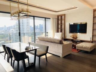 Modern living room with dining area and city view